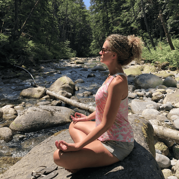 Danielle gray meditating in bc wilderness