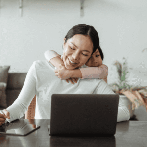 Mom working on computer smiling